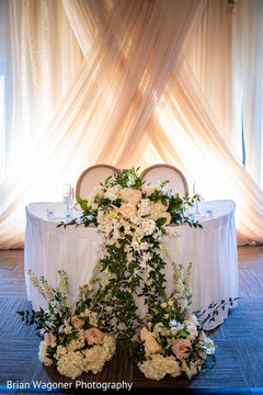 Indian lovebirds white wedding reception table decor. Indian lovebirds white wedding reception table decor.