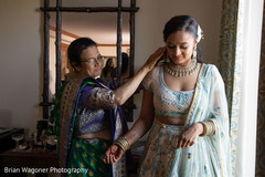Maharani gettin her ceremony kundan necklace on. Maharani gettin her ceremony kundan necklace on.