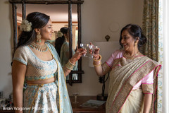 Indian bride on her white and sky blue lehenga having cheers. Indian bride on her white and sky blue lehenga having cheers.