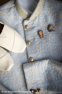Indian groom's sky blue sherwani and white mojaris. Indian groom's sky blue sherwani and white mojaris.