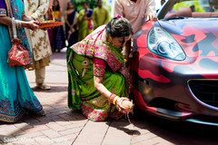 Indian bridesmaid picking up coconut. Indian bridesmaid picking up coconut.