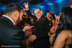 Indian wedding guests having a great time during the party. Indian wedding guests having a great time during the party.