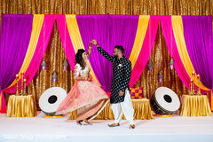 Indian couple dancing during photo session. Indian couple dancing during photo session.