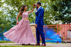 Maharani wearing an Anarkali and Indian groom in blue suit. Maharani wearing an Anarkali and Indian groom in blue suit.