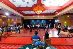 Indian couple watching the groomsmen performance. Indian couple watching the groomsmen performance.