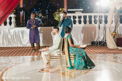 Indian couple playing the shoe game at Sangeet. Indian couple playing the shoe game at Sangeet.