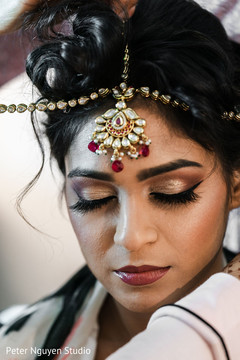 Indian bride getting her matha patti on . Indian bride getting her matha patti on .