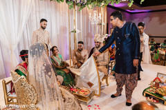 Ceremonial cloth dividing the couple is dropped. Ceremonial cloth dividing the couple is dropped.
