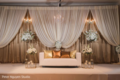 Beige drapery backdrop for reception stage. Beige drapery backdrop for reception stage.