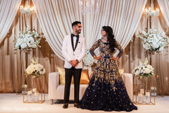 Indian couple exchanging glances in their reception stage. Indian couple exchanging glances in their reception stage.