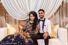 Indian couple's portrait at their wedding reception stage. Indian couple's portrait at their wedding reception stage.