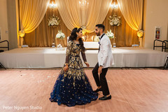 Indian couple dancing at their wedding reception. Indian couple dancing at their wedding reception.