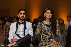 Elegant Indian couple during their reception entertainment. Elegant Indian couple during their reception entertainment.