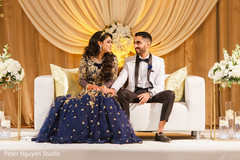 Just married couple posing at their wedding stage. Just married couple posing at their wedding stage.