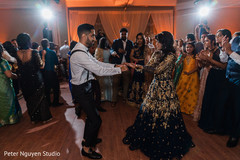 Indian bride and groom dancing at the tunes of the music. Indian bride and groom dancing at the tunes of the music.