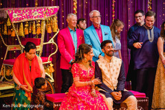Indian couple and Indian relatives sitting during the sangeet Indian couple and Indian relatives sitting during the sangeet