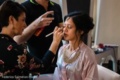 Indian bride getting her makeup done. Indian bride getting her makeup done.