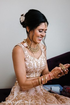 Indian bride placing her bridal bangles. Indian bride placing her bridal bangles.