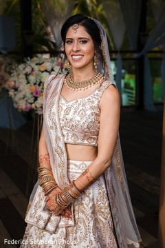 Indian bride using her ceremony lehenga and golden jewelry. Indian bride using her ceremony lehenga and golden jewelry.