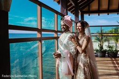 Indian couple posing next to window photo shoot. Indian couple posing next to window photo shoot.