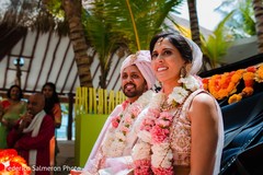 Indian bride and groom at their wedding vehicle. Indian bride and groom at their wedding vehicle.