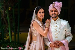Indian couple posing on their ceremony outfits portrait. Indian couple posing on their ceremony outfits portrait.