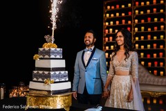 Cheerful Indian bride and groom cutting the cake. Cheerful Indian bride and groom cutting the cake.