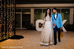 Indian couple at wedding reception entrance. Indian couple at wedding reception entrance.