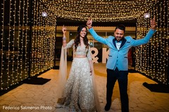 Indian couple making their entrance to reception party. Indian couple making their entrance to reception party.