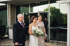 Indian bride with her parents making her arrival. Indian bride with her parents making her arrival.