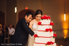 Indian bride and groom cutting the cake. Indian bride and groom cutting the cake.