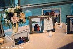 Table of pictures from the Indian newlyweds at the reception venue. Table of pictures from the Indian newlyweds at the reception venue.