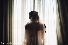 Indian bride looking through the window. Indian bride looking through the window.