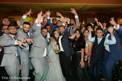 Indian newlyweds with special guests during the reception. Indian newlyweds with special guests during the reception.