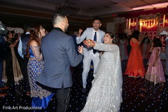 Indian bride and groom dancing during the reception. Indian bride and groom dancing during the reception.