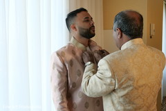 Indian groom being assisted by his father prior to the ceremony. Indian groom being assisted by his father prior to the ceremony.