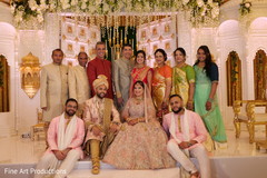 Indian bride and groom posing with special guests. Indian bride and groom posing with special guests.