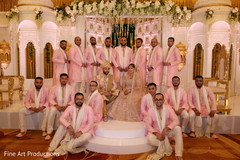 Groomsmen posing with Indian newlyweds. Groomsmen posing with Indian newlyweds.
