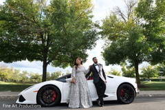 Indian bride and groom posing for pictures by the car. Indian bride and groom posing for pictures by the car.