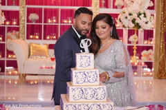 Indian bride and groom cutting the cake. Indian bride and groom cutting the cake.