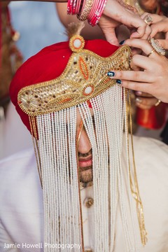 Indian groom with sehra.