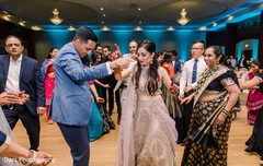 Indian bride and groom joyfully dancing at their reception. Indian bride and groom joyfully dancing at their reception.