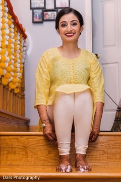 Indian bride wearing a traditional yellow outfit for her haldi event. Indian bride wearing a traditional yellow outfit for her haldi event.
