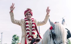 Indian groom on his white baraat horse photo. Indian groom on his white baraat horse photo.