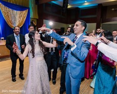 Indian bride and groom celebrating at reception party. Indian bride and groom celebrating at reception party.
