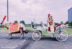 Indian couple on their white and red carriage. Indian couple on their white and red carriage.