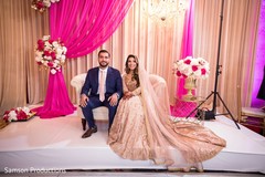Indian newlyweds sitting on stage Indian newlyweds sitting on stage