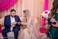 Indian couple exchanging rings Indian couple exchanging rings