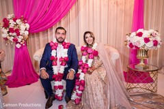 Indian newlyweds wearing necklaces Indian newlyweds wearing necklaces