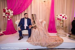 Indian newlyweds sharing a moment on stage Indian newlyweds sharing a moment on stage